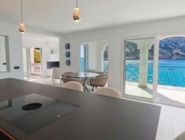 Sea view duplex penthouse for sale in port d'andratx with private rooftop and direct sea access