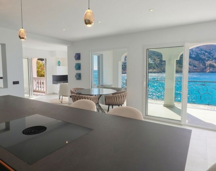 Sea view duplex penthouse for sale in port d'andratx with private rooftop and direct sea access