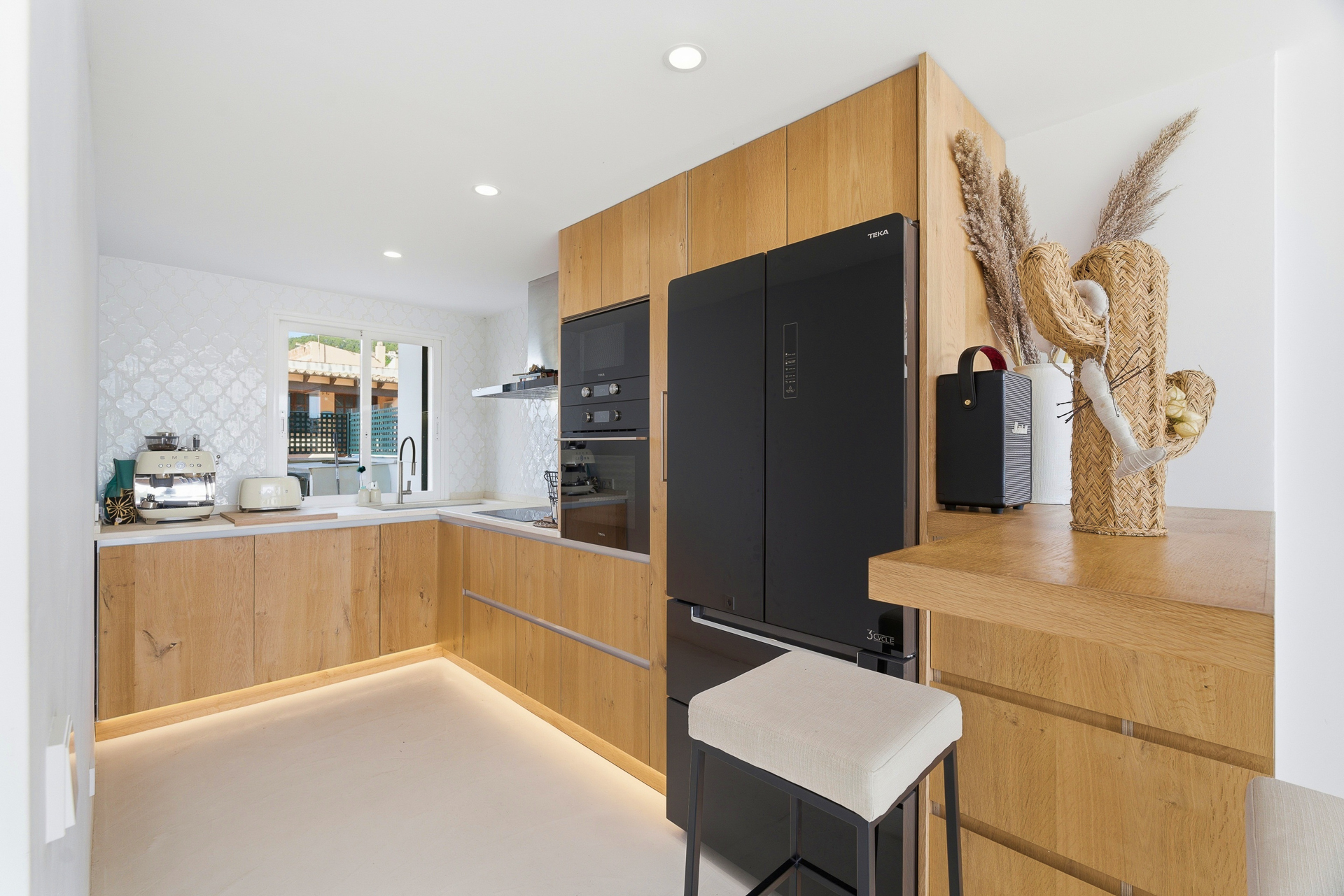 Contemporary townhouse for sale with garden and rooftop terrace in andratx