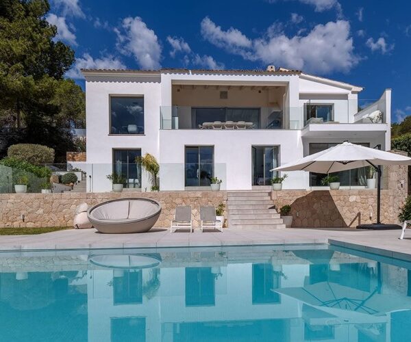 Refurbished five-bedroom villa with a rare flat garden for sale in camp de mar
