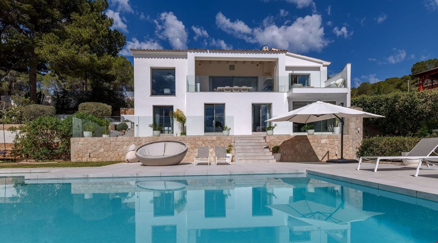 Refurbished five-bedroom villa with a rare flat garden for sale in camp de mar