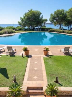 Refined coastal apartment with expansive terrace and sea views in portals nous