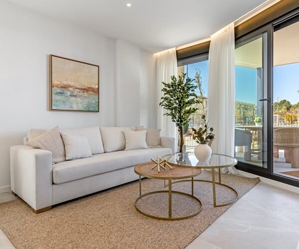Modern two-bedroom garden apartment with communal pool in palmanova