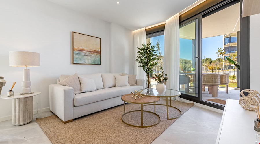 Modern two-bedroom garden apartment with communal pool in Palmanova