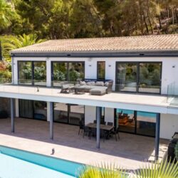 Contemporary coastal sanctuary with infinity pool and gym in port d’andratx