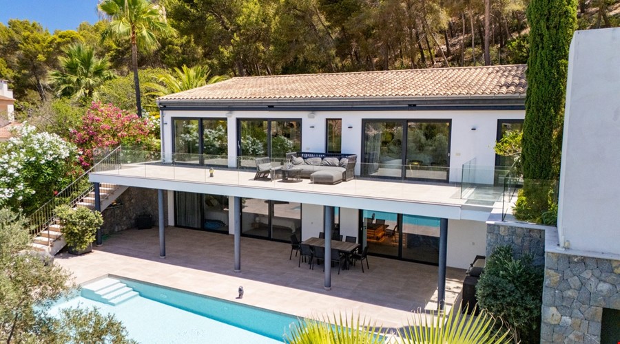 Contemporary coastal sanctuary with infinity pool and gym in port d’andratx