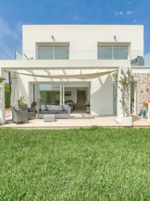 Modern three-bedroom coastal villa with sun-drenched terraces for sale near llucmajor